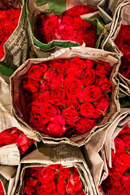 Some of the many varieties of flowers found at the wholesale flower market in Bangkok.  The market, known as Pak Klong Talat in Thai, is open around the clock and is busiest in the early hours of the morning when growers bring flowers, fruit, and vegetables into the city.    Each bundle of 50 roses costs about two dollars : ) Flower Shops, Colorful Roses, Rose Rouge, Wholesale Flowers, Love Rose, Flower Market, Flower Field, The Store, Red Hot