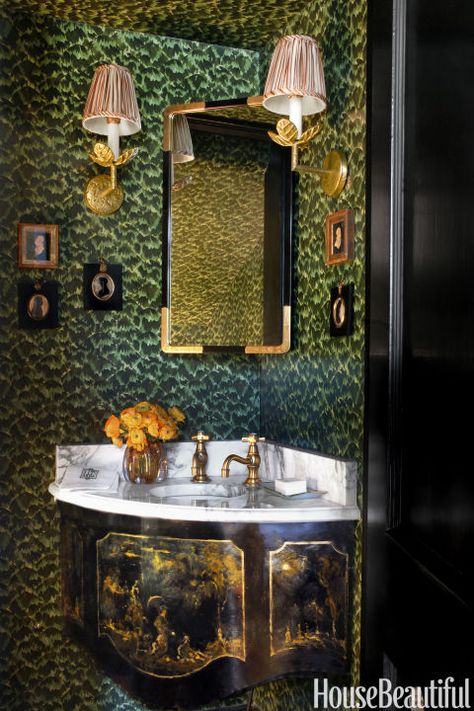 Powder rooms are a designer's calling card," Rufty says. She reimagined this one with wallpaper by Celerie Kemble for Schumacher and a new custom metal sink apron hand-painted with a chinoiserie scene by Thomas Oppliger. Wallpapered Bathrooms, Fun Bathroom Wallpaper, Classic Southern Home, Wallpaper For Small Bathrooms, Marble Effect Wallpaper, Small Bathroom Wallpaper, Georgian Style Homes, Metal Sink, Louisiana Homes