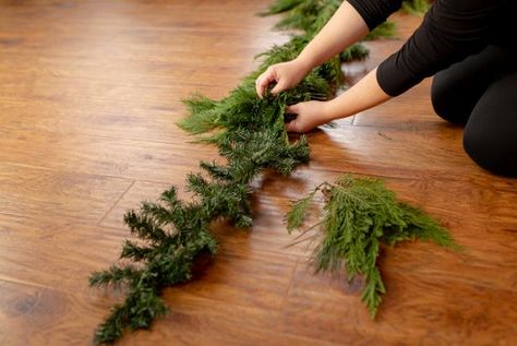 A nine-foot, wired faux garland (linked below) serves as the base for our swag and adds extra fullness to the finished product. How To Make Real Garland, How To Make Fresh Garland, How To Make Garland With Real Greenery, Garland Christmas Decor Diy, Fresh Pine Garland, Diy Greenery Garland, Foraged Garland, Evergreen Garland, Faux Garland