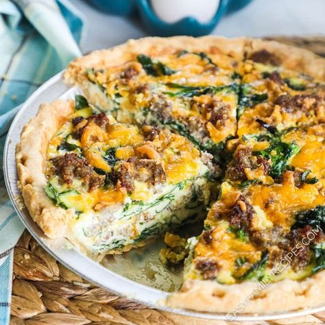 BEST Quiche ever! Using our easy method, this Spinach Sausage Quiche is the lightest, creamiest, most delicious quiche recipe. This quiche recipe is perfect for breakfast, brunch, lunch, or even a light dinner. Our Cheesy sausage spinach quiche is always the first thing to go at brunch or a potluck and a family favorite. This Quiche is made with rich, creamy eggs, savory sausage and fresh spinach for a flavor combo that can't be beat! Sausage Spinach Quiche Recipes, Sausage Egg Quiche, Quiche Breakfast Recipes, Sausage Spinach Quiche, Sausage And Spinach Quiche, Quiche Sausage, Breakfast Quiche Sausage, Egg Quiche Recipes, Sausage Quiche Recipes