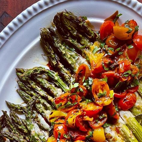 Diane Morrisey on Instagram: "Everything's better Caprese'd!  Roasted Asparagus blanketed with Melty Mozzarella and topped  with Roasted Tomatoes, tossed with basil and drizzled with a homemade Balsamic drizzle is a perfectly seasonal Spring dish that would be an excellent addition to your Easter buffet! . . . Caprese Roasted Asparagus  . . . (recipe adapted from @delish ) 1 lb. asparagus, stalks trimmed Extra-virgin olive oil  Kosher salt and freshly ground black pepper 1 cup shredded mozzarella 2 c. cherry tomatoes, halved 1/2 cup sliced fresh basil   Preheat oven to 425F.  On a large baking sheet, toss asparagus with olive oil and season with salt and pepper.  On the other side of the baking sheet, toss cherry tomatoes with olive oil and season with salt and pepper.  Roast for 10 minute Roasted Asparagus Recipe, Easter Buffet, Balsamic Drizzle, Spring Veggies, Spring Dishes, Buzzfeed Tasty, Roasted Asparagus, Eat The Rainbow, Buzzfeed Food