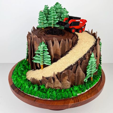 Skid Steer / Tree Stump Cake! Chocolate cake layers with Nutella buttercream encased in a chocolate buttercream. Decorated with chocolate bark and a candy melt trees. Buttercream Trees On Cake, Skid Steer Birthday Cake, Skid Steer Birthday Party, Skid Steer Cake, Buttercream Trees, Atv Cake, Moto Cake, Hiking Cake, Jeep Cake