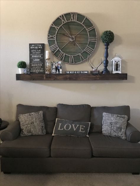 Photo Wall Collage With Clock, Clock And Shelves Wall Decor, Floating Shelves With Clock, Shelf Under Clock On Wall, Big Clocks In Living Room, Big Clock Decor Living Rooms, Living Room Wall Decor With Clock, Large Clock Wall Decor Living Rooms, Large Clocks Living Room