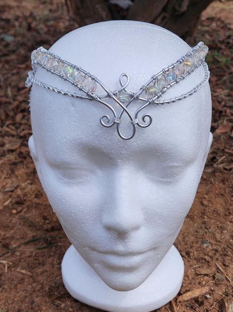 Handmade elegant silver wire circlet with clear iridescent accented beads. Great for weddings, costumes, cosplay, festivals, or personal wear.  Can also be made with yellow gold or copper colored wire, or a variety of color of beads! Can be made in child's size upon request!  Please message me for custom alterations before purchasing. Celtic Headpiece, Wire Circlet, Circlet Crown, Elven Circlet, Elven Fairy, Cosplay Crown, Wire Crown, Crown Headpiece, Ren Fair