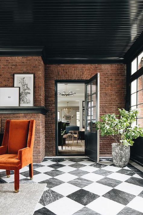 Black Sunroom, Brick Sunroom, Harlequin Floors, Jean Stoffer Design, Checkered Floor, Red Brick Wall, Brick Interior, Interior Windows, Black Ceiling