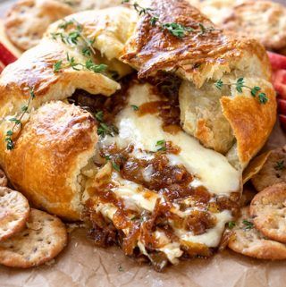 This baked brie in puff pastry is topped with balsamic caramelized onions, and is a scrumptiously warm, cozy and elegant appetizer to share! | thecozyapron.com #bakedbrie #bakedbrieinpuffpastry #bakedbrierecipes #bakedbrieeasy #bakedbrieappetizer Brie With Caramelized Onions, Pastry Making, Baked Brie Recipes, Baked Apple Dessert, Brie Puff Pastry, Brie Recipes, Elegant Appetizers, Baked Cheese, Charcuterie Recipes