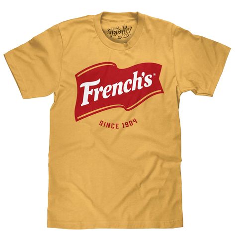 PRICES MAY VARY. YOUR NEW FAVORITE MUSTARD T-SHIRT: Show the world your love for French's with this graphic tee featuring the iconic French's flag logo and "Since 1904" text - tastefully printed on the softest mustard yellow cotton tee we could find. EASY CARE TEES: This French's logo design is licensed and screen-printed on a soft, 100% cotton t-shirt that goes from the washing machine to the dryer without losing shape, shrinking or fading. NO FUSS SIZING: Tee Luv's condiment shirts feature a s Cut Graphic Tee, French Logo, French Flag, Casual Night Out, Flag Logo, Yellow T Shirt, Screenprinting, Style Board, Mustard Yellow