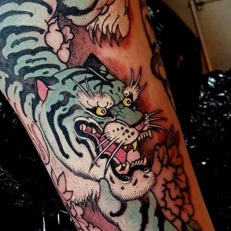 Tattoo uploaded by Tattoodo | Blue tiger tattoo by Elliott Wells #ElliottWells #cattattoos #tiger #color #japanese #neotraditional #mashup #irezumi #junglecat #fangs #peony #claws #nature | 492591 | Tattoodo Japanese Tattoos Oni, Traditional Japanese Tattoo Sleeve, Traditional Tiger Tattoo, Japanese Tattoo Women, Bodysuit Tattoos, Japanese Tiger Tattoo, Irezumi Tattoo, Dragon Tattoo Back Piece, Japanese Tattoo Symbols