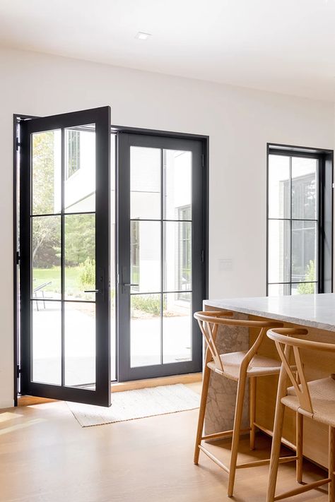 Moody Colors: Decorating with Black Windows & Doors | Marvin Modern French Doors Black, Black French Doors To Patio, Windows With Black Trim, Black Windows And Doors, Black Vinyl Windows, Black Windows Exterior, Black French Doors, Black Window Trims, Marvin Windows And Doors