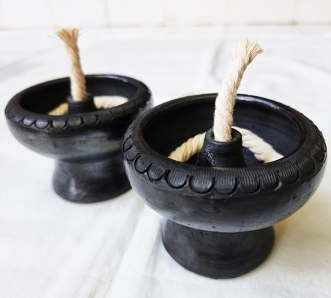 1 pair of Pottery Oil Lamp, Black clay lamp Handmade Terracotta round Décor Home Produced by a group of villagers from Koh Kret, Nonthaburi, famous for making traditional Thai pottery. uniqueness and unique beauty the only place in Thailand. Color – Black Material – Clay Quantity – 1 pair Size – 3.5”(width) x 3”(height) ## Made in Thailand ## Clay Oil Lamp, Ceramic Oil Lamp, Thai Pottery, Oil Lamp Decor, Clay Lamp, Ancient Oil Lamp, Thai Decor, Lamp Handmade, Temple Art