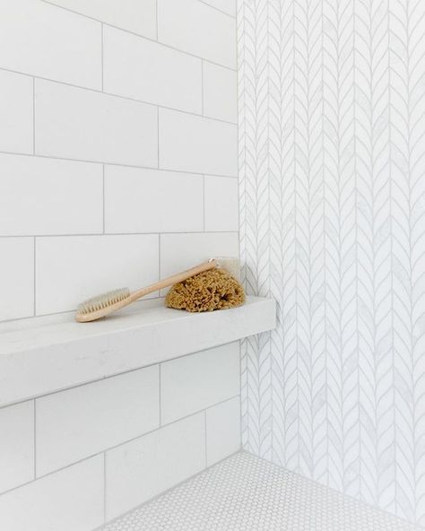 A floating white Caesarstone mini shelf is the perfect shaving ledge and place to stash showering essentials. The thassos and mother-of-… Bathroom Niche Design, Tile Shower Shelf, The Weather Outside Is Frightful, Weather Outside Is Frightful, Bathroom Shower Design, Shower Storage, Master Shower, Shower Niche, Master Bath Remodel