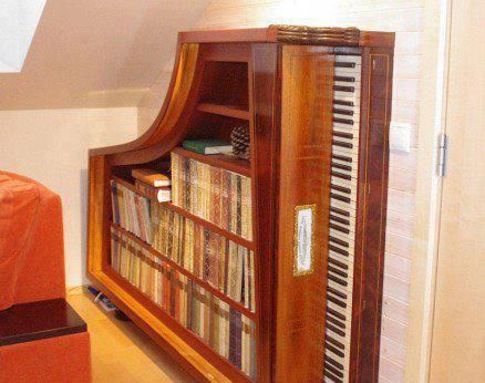 Piano bookcase - (another use for old pianos - man I need to get old pianos - I had no idea they were so versatile) Roland Piano, Oscar Peterson, Robert Schumann, Maurice Ravel, Johannes Brahms, Franz Schubert, Claude Debussy, Bill Evans, Frédéric Chopin