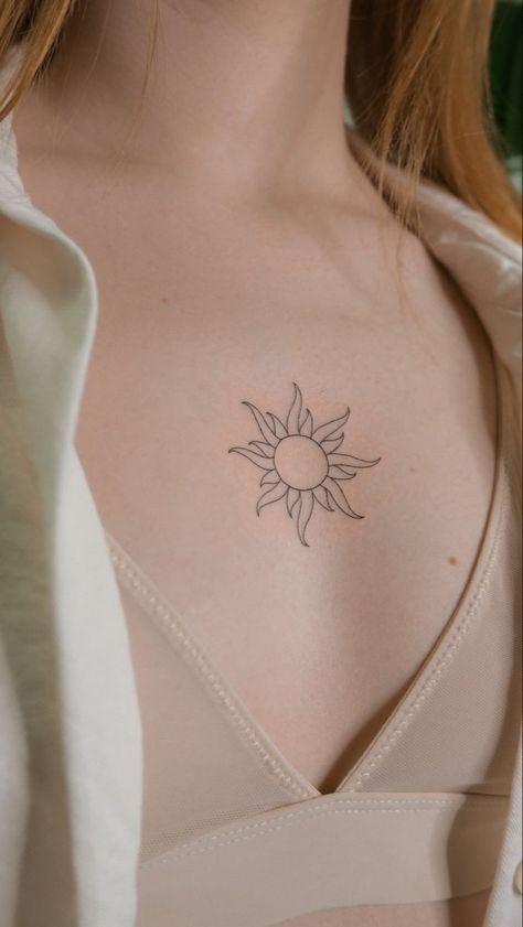 finelinesun tattoo between breasts Sun Chest Tattoo, Fineline Sun Tattoo, Tattoos Between Breast, Tattoo Breast, Tattoo Between Breast, Black Color Hairstyles, Tattoo Sun, Tattoo Chest, Jewel Tattoo