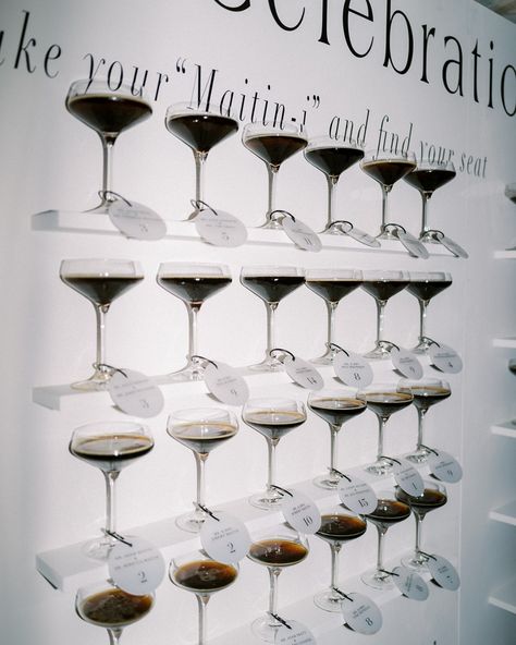 When your groom’s last name gives you the perfect excuse for an espresso martini seating chart, you just have to go for it! 🍸An escort wall of elegant espresso martinis, each glass tagged with a guest’s name and table number is a classy, unforgettable start to the celebration.

#escortwall #seatingchart #weddingdetails #weddingideas #weddingseatingchart #espressomartini #weddingdecor #luxurywedding #nycwedding #martiniseatingchart  #seatingchartinspo #alinatoevents Classy Seating Chart Wedding, Wedding Espresso Martini, Espresso Martini Tower Wedding, Martini Station, Champagne Wall Seating Chart, Espresso Martini Bar, Martini Wedding, Martini Tower, Espresso Martinis