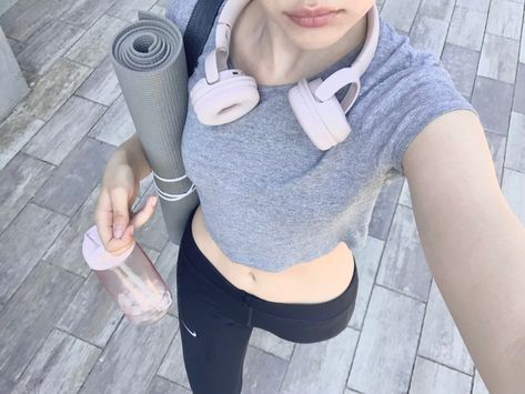 A Woman, Headphones, Water Bottle, Yoga, Water