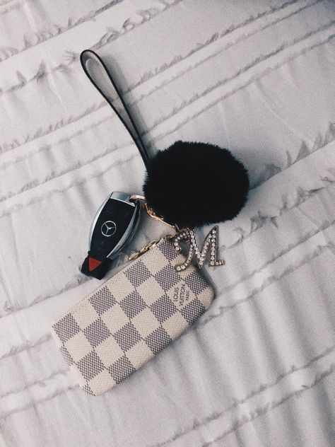 Aesthetic keys and key chain with Louis Vuitton key pouch, puff ball, and jeweled initial. Initial Aesthetic, Aesthetic Keys, Car Keychain Ideas, Aesthetic Keychain, New Car Accessories, Louis Vuitton Key Pouch, Girly Car Accessories, Key Keychain, Girly Car