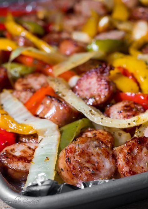 Italian smoked sausage, peppers and onion made on a sheet pan right in the oven. Only a one pan dish, these recipes are so easy to make and delicious with fresh cut bell peppers drenched in olive oil then brought to a crisp! Peppers And Onions In Oven, Sheet Pan Sausage, Sausage Recipes For Dinner, Sausage Peppers And Onions, Smoked Sausage Recipes, Sausage Dinner, Sausage Peppers, Italian Sausage Recipes, Sausage Dishes