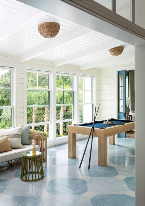 A painted floor grounds the gallery connecting the original house to the addition. Serena & Lily’s Santa Barbara rattan flush mounts preside over the pool table from Blatt Billiards and a 1960s rattan sofa found at The Antique and Artisan Gallery. South Carolina Beach House, Rattan Flush Mount, Carolina Beach House, South Carolina Beach, South Carolina Beaches, Serena Lily, Painted Floor, Carolina Beach, Bunk Room