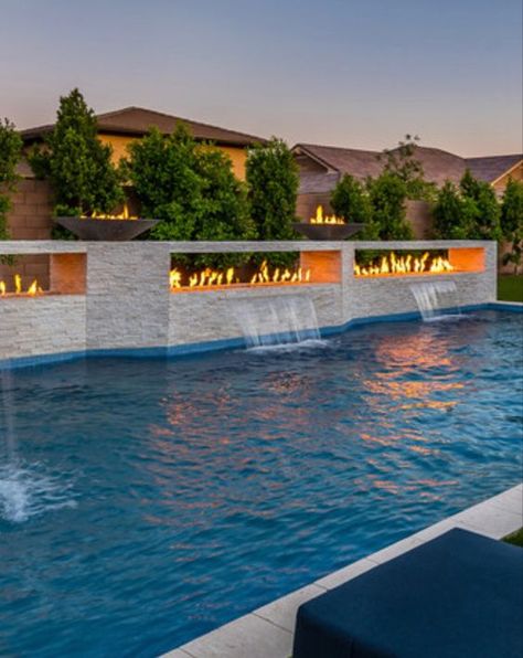 Modern Pool With Fire Feature, In Ground Pool Water Features, Fire Features Pool, Pool Waterfall Wall Tile, Pool With Hot Tub And Fire Pit, Modern Pool With Waterfall, Sloped Hardscape, Modern Pool Waterfall, Rectangular Pool Landscaping