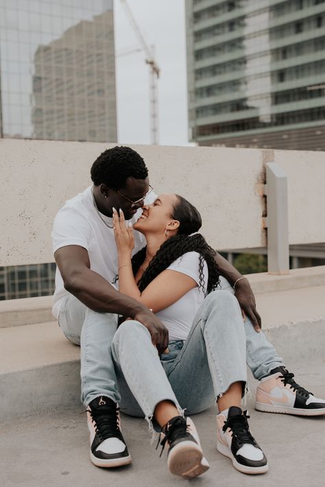 Downtown phoenix engagement session, Arizona engagement session, couples session in phoenix, rooftop garage engagement session, matching sneakers at engagement session, white t shirt and jeans, candid engagement photos, unposed couples pictures, natural lighting Engagement Photos With Sneakers, Sneaker Engagement Photos, White T Shirt And Jeans, Matching Sneakers, Arizona Engagement, Candid Engagement Photos, Couples Pictures, Downtown Phoenix, Couples Session