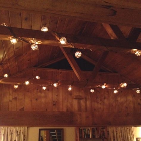 "Garden" lights wrapped around ceiling beams :-) Fairy Lights On Beams Ceilings, Beams With Lights, Beam With Lights, Fairy Cabin, Shed With Porch, Lighthouse Wedding, Wood Ceiling Lights, Floor Lighting, Cottage Witch