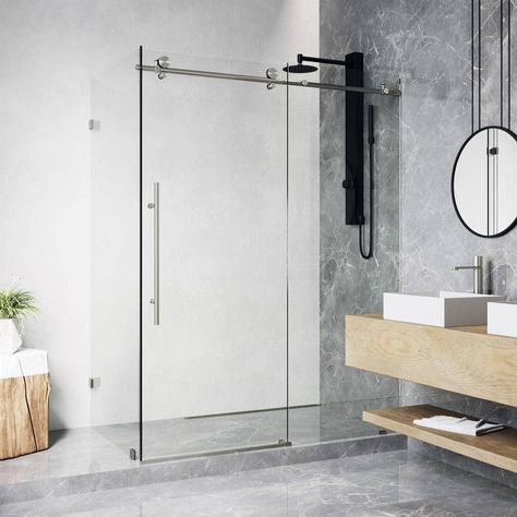 Refined and unobstructed, The Elan E-class by VIGO is a timeless shower enclosure with touches of noteworthy elegance. Sleek hardware adds luxury to thick tempered clear glass. Its minimalist shower doors allow its classic details to shine. Sky-high frameless sliding doors provide an open concept entryway. Premium quality stainless steel hardware with a stainless steel finish ensure a lifetime of optimal performance. The Elan E-class is engineered with VIGO's proprietary technology and is easy t Frameless Sliding Doors, Shower Sliding Glass Door, Minimalist Showers, Corner Shower Enclosures, Frameless Sliding Shower Doors, Vertical Doors, Frameless Shower Enclosures, Glass Shower Enclosures, Frameless Shower Doors