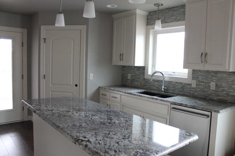 granite countertops in gray Gray Granite Countertops, Silver Backsplash, Lennon Granite, White Kitchen Units, Dark Granite Countertops, Grey Granite Countertops, Brown Granite Countertops, Kitchen Rehab, Light Grey Kitchen Cabinets