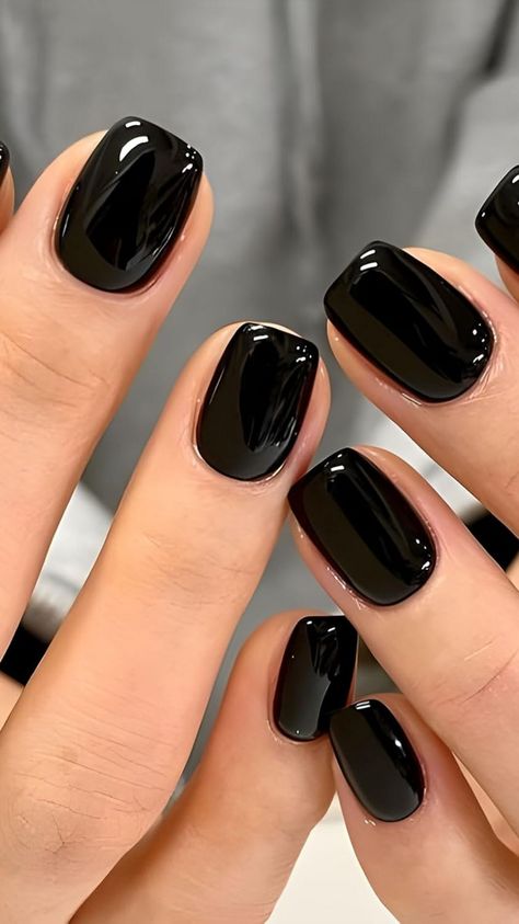 Step into the season with these stunning short fall black press-on nails! Featuring chic black manicure designs with gold accents, these nails give you that celestial look—perfect for dark nails with stars. Whether you’re after New Year’s nail short styles or elegant nail art on dark nails, these nails are easy to apply and long-lasting. Ideal for women and girls who love black cute nail designs. Get your set now and shine with effortless glam this fall! Short Black Nails With Accent Nail, Glittery Black Nails Short, Very Short Black Nails, Black Nails 2024, Classy Black Nails Short, Black Manicure Ideas, Black Shiny Nails, Short Square Nails Black, Dark Nails Ideas