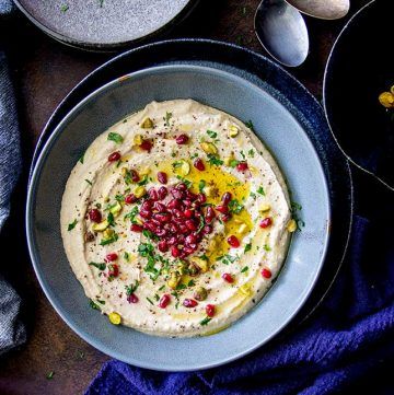 A quick and easy hummus recipe makes the perfect party dip. And this loaded hummus takes the classic Lebanese chickpea dip and turns it into a party worthy platter dish. So beautiful and so packed with flavor. #dip #hummus #homemade #partyfood #quickdip Loaded Hummus, Cooking Potatoes, Vegetable Kebabs, Mushroom Tart, Roasted Cauliflower Salad, Easy Hummus Recipe, Party Dip, Mild Salsa, Easy Hummus