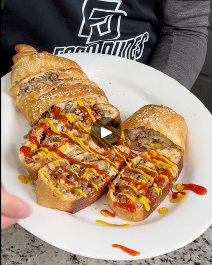 91K views · 1.1K reactions | Easy Bacon Cheeseburger Roll-ups 🍔 | Easy Bacon Cheeseburger Roll-ups 🍔 | By Brain Food | Start by unrolling our
Pillsbury Pizza Crust and we're just going to unroll this onto
our sheet pan. We have some nice parchment paper here.
Alright, after your pizza dough is spread out, we're going to
put down some American singles. I'm using craft singles here
but you can use Velveeta, whatever kind of cheese you
want and there we go. Now, we're going to get one pound of
cooked and drained ground beef. We're just going to put it
right on top here. I'm going to spread it out with my hands.
So, it doesn't have to be too perfect here. Just going to go
side to side. Put a nice layer of this beautiful burger meat
down we're going to season this with a little bit of salt so Easy Bacon Cheeseburger Roll Up, Garlic Butter Bacon Cheeseburger Rollups, Copycat In And Out Sauce, Hamburger Wraps, In And Out Sauce, Pillsbury Pizza Crust, Pillsbury Pizza, Hamburger Pizza, Sandwich Wraps Recipes