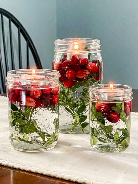 Simple DIY Christmas Crafts - My Family Thyme Cranberry Floating Candles, Floating Candles Cranberries, Floating Cranberries Centerpiece, Easy Xmas Centerpieces, Diy Table Centerpieces Christmas, Simple Winter Centerpieces Diy, Easy Holiday Centerpieces, Cheap Christmas Centerpieces Diy, Glass Jar Christmas Decor