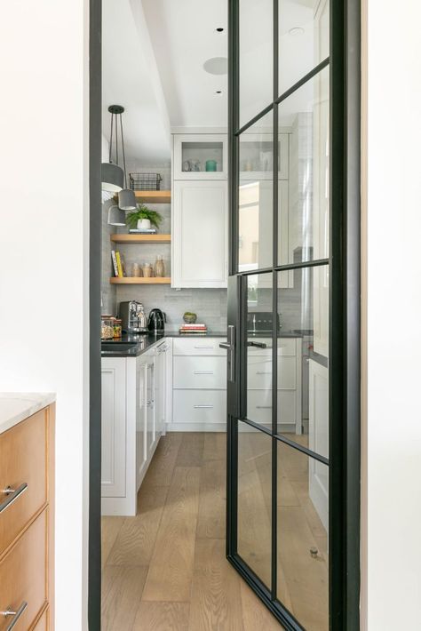 Black And White Pantry, Pantry With Glass Doors, Stainless Steel Kitchen Shelves, Black Stainless Steel Kitchen, White Pantry, White Siding, Steel Front Door, Arched Doors, Wide Plank Flooring