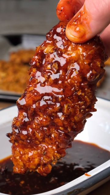 The Good Bite on Instagram: "BBQ Cajun Chicken Tenders 😍 SAVE this one for later and TAG a friend 🙏 Crispy chicken tossed in a BBQ glaze - a healthy alternative to fried chicken & very quick to make 🤌 500g of chicken tenders. Cajun seasoning. Cayenne pepper. Smoked paprika.  1/4 tsp of salt. Black pepper, to taste. 2 eggs. 150g of cornflakes. 2 tbsp BBQ sauce. 2 tbsp of Honey. A squeeze of lemon. 1 plump clove of garlic - finely chopped. Full recipe is on our website. Link in bio. #TheG Bbq Cajun Chicken Tenders, Tossed Chicken Tenders, Bbq Tenders, Glazed Chicken Tenders, Glazed Fried Chicken, Honey Bbq Chicken Tenders, Cajun Chicken Tenders, Crispy Cajun Chicken, Bbq Chicken Strips