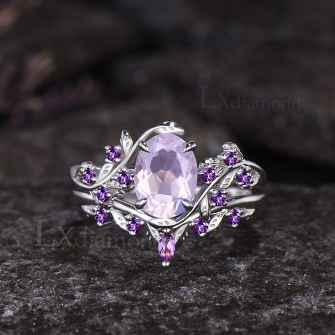 Item description ✦ Handmade, high-quality item! ✦ Material: 925 sterling silver, Solid 10k/14K/18K GOLD (can be made in white/rose/yellow gold) Engagement ring ✦ Center stone: Natural Lavender Amethyst ✦ Size/Weight: 6x8mm Oval Cut ✦ Side stone: Round Cut Natural Amethyst Wedding band ✦ Gemstones: Marquise Cut and Round Cut Natural Amethyst Any ring size can be made,if the ring size is not in the option list ,contact me. As it is handmade,it needs 2-4 weeks to finish and then be shipped by usps Unique Purple Engagement Rings, Wedding Ring Purple Stone, Fairy Core Ring, Unique Oval Amethyst Wedding Ring, Silver Amethyst Ring With Intricate Design For Wedding, Elegant Lavender Crystal Wedding Ring, Fairy Engagement Ring Amethyst, Purple Engagement Ring, Purple Wedding Rings