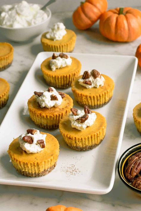 These silky smooth Mini Pumpkin Cheesecakes are a fun dessert to serve at your holiday feast. They are so cute! The buttery pecan crumb crust is filled with a rich and creamy cashew pumpkin filling. It's a wholesome dessert with the same classic tanginess of real cheesecake but dairy free and gluten free! Gluten Free Desserts Thanksgiving, Pumpkin Cheesecakes, Mini Strawberry Cheesecake, Paleo Pumpkin Pie, Individual Cheesecakes, Crumb Crust, Pumpkin Filling, Mini Pumpkin Cheesecake, Pecan Cheesecake