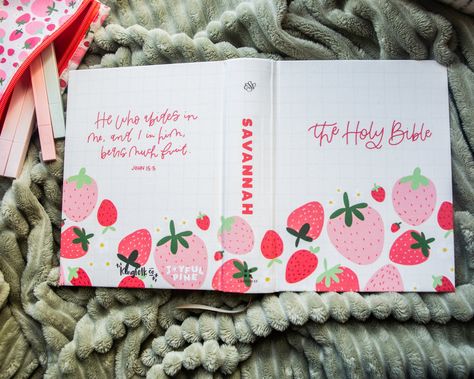 This strawberry designed Bible by Savannah at Joyful Pine is so very SWEET indeed! We love this Bible so much! It features a professionally printed cover - NO, not hand painted but PRINTED professionally in-house for the ultimate in quality and durability. You're going to LOVE this bible! + SPECS + + New Updated High Quality Hardboard with Fabric cover+ Single column, paragraph format, 7.5 font+ Crossway ESV Journaling Bible+ Cream-colored paper+ Ribbon marker+ 2" ruled margins for writing+ 6.25 in x 8.0 in+ Perfect size for taking to church+ Professionally printed in-house Please note that the spine will have a small gap in the print where the book bends. Since all our items are printed in-house, there might be a slight difference between the product preview and the finished printed resul Simple Crafts To Sell, Painted Bible Cover Ideas, Bible Painting Cover, Bible Cover Ideas, Painting Bibles, Painted Bible Cover, Paragraph Format, Painted Journals, Bible Accessories