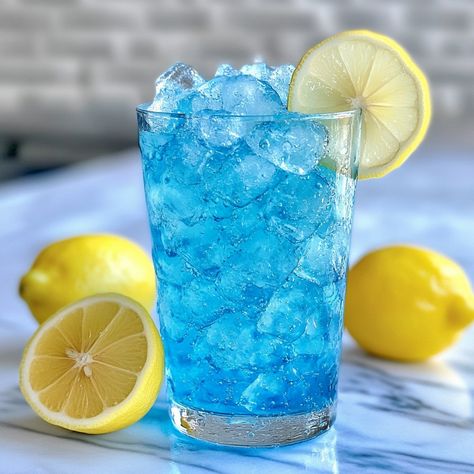 🍹 "Unleash the cool with Unchained Chill—a smooth and icy escape that’s irresistibly refreshing! ❄️🍸 #UnchainedChill #IcyVibes" Unchained Chill Ingredients: Vodka (1 1/2 oz) Blue curaçao (1 oz) Lemonade (2 oz) Club soda (1 oz) Crushed ice (as needed) Lemon slice (for garnish) Instructions: Fill a glass with crushed ice. Add vodka, blue curaçao, and lemonade. Top with club soda and garnish with a lemon slice. 🍹 "Unchained Chill is your ultimate cool-down drink. Dive into this icy, vibrant ... Curacao Drink, Vodka Blue, Liquor Drinks, Blue Curacao, Club Soda, Crushed Ice, Lemon Slice, The Cool, Lemonade