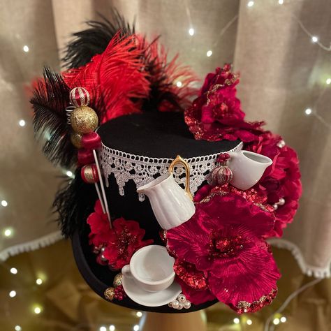 Another edition to our Mad Hatter Top Hat series! This one-of-a-kind piece features a black top hat base, with red floral decoration, red and black feathers, lace and a white porcelain tea set. Size: Medium (59cm) Whimsical Top Hat For Halloween Themed Events, Whimsical Adjustable Top Hat For Halloween, Creative Hats, Mad Hatter Hat Design, Top Hats For Women Mad Hatters, Country Style Brimmed Top Hat, One Size, Mad Hatter Top Hat, Red Hat Ladies, Mad Hat