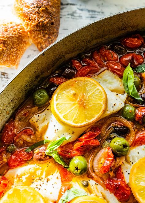 Easy Mediterranean Baked Cod Recipe with Roasted Tomatoes- each bite of tender, flaky cod, roasted tomatoes, and flavorful olives is a satisfying and Baked Mediterranean Cod, Mediterranean Baked Cod, Cod With Tomatoes, Cod Fish Recipes Baked, Baked Cod Recipes, Roasted Cod, Cod Fish Recipes, Fish Recipes Baked, Cod Recipe