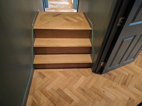 These awkward steps could have been a complete eyesore, but thanks to a clever bit of planning they have become a beautiful feature.  We clad the steps in engineered oak boards and then fitted the aged parquet on top, to match the rest of the flooring. Floor Patterns Wood, Hardwood Floor Ideas, Wood Flooring Design, Wood Floor Stairs, Flooring Design Ideas, Stairs Cladding, Oak Parquet Flooring, Floor Restoration, Parquet Floor