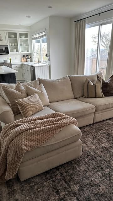 Brittany | Home Inspo | Decor Finds | Organization on Instagram: "This couch is over 13 years old! It’s survived three moves and two kids. It has definitely seen better days and the style feels dated to me, but updating the throw pillows made a huge difference!

I recommend choosing quality down inserts and swapping out your pillow covers as the season or your style changes.

Comment “pillows” for a link!

Living room inspo
Neutral home decor
Couch styling 
Sofa styling
Colin and Finn 
Organic modern

#homedecor #organicmodern #neutralhome #interiordesign #livingroomdecor #throwpillows #colinandfinn" Light Tan Leather Couch Living Room, Living Room Decor Tan Couch, Oatmeal Couch Living Rooms, Light Brown Couch Living Room Ideas, Cozy Couches Living Room, Room Inspo Neutral, Tan Leather Couch Living Room, Khaki Sofa, Colin And Finn