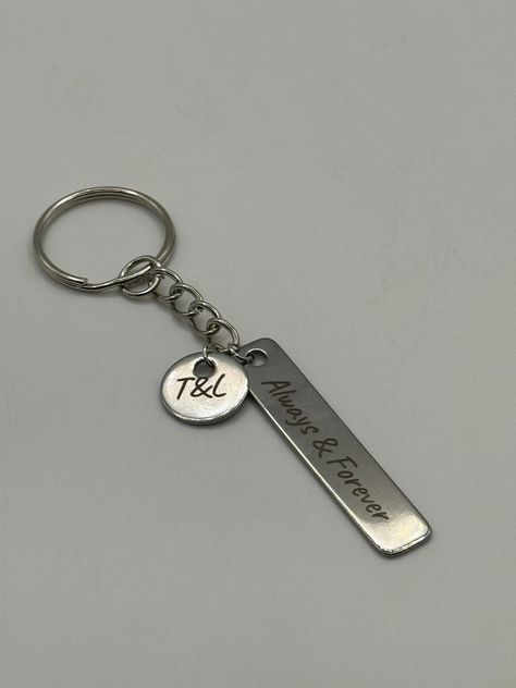 Beautifully engraved stainless steel keychain. Personalized with the initials of your choice. Cute gift idea for couples!  Size:  Rectangle 1.96" Round 0.6" Material: the metal tags are made of quality stainless steel material, strong and sturdy, enough to withstand the outdoors. Suitable for Outdoor Use: the metal tags are not only strong and reliable, but are also waterproof and rustproof, suitable for outdoor events like camping, hiking or fishing, ensuring that your designs maintain their shine and integrity even when exposed to varying weather conditions.  Keychain Ring - metal ring with chain: 1''(25mm) with 1" length extension chain.  DURABLE MATERIAL --- The round keyrings are made of iron which make them strong and sturdy for use. And silver-toned nickel plating makes them shiny a Gift Idea For Couples, Ring With Chain, Initial Keychain, Keychain Ring, Couples Keychains, Couples Anniversary, Keychain Personalized, Nickel Plating, Metal Tags