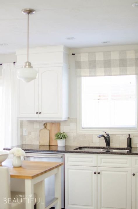 A window valance made from neutral buffalo check fabric compliments this simple farmhouse kitchen perfectly. Visit aburstofbeautiful.com for the full tutorial | A Burst of Beautiful Kitchen Window Treatments Ideas, Farmhouse Kitchen Window, Simple Farmhouse Kitchen, Kitchen Window Blinds, Kitchen Window Valances, Farmhouse Kitchen Curtains, Trendy Farmhouse Kitchen, Valance Ideas, Curtains Decor