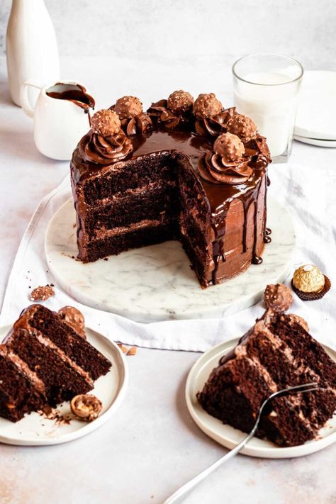 The Most Amazing Ferrero Rocher Cake - Rich And Delish Hazelnut Cake Recipe, Chocolate Cake Shot, Hazelnut Dessert, Cake Shot, Ferrero Rocher Cake, Hazelnut Recipes, Chocolate Hazelnut Cake, Resep Cake, Hazelnut Cake