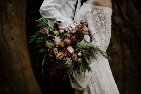 Loved working on this bridal bouquet for K+D's redwood forest wedding, complete with mushrooms, cedar, lisianthus, mums, and chocolate cosmos. Expertly captured by Quinn Oberlander! Forest Bride Bouquet, Mushroom Bridal Bouquet, Pagan Wedding Bouquet, Fairy Bridal Bouquet, Mushroom Wedding Bouquet, Forest Wedding Flowers, Forest Wedding Bouquet, Mushroom Bouquet, Dnd Wedding