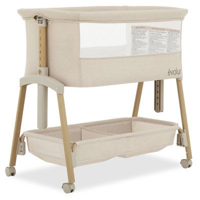 Experience the perfect blend of comfort and convenience with Evolur Lullaby Portable Bassinet With Wheels! This foldable and portable bassinet is your ideal companion for on-the-go parenting. Featuring convenient wheels, this portable bassinet allows you to effortlessly move your baby from room to room. Boasting an extremely sturdy frame, the Lullaby ensures a secure environment for your baby. The seven adjustable height positions, complemented by a second lock, provide versatility for your conv Bed Side Bassinet, Baby Basinets, Wooden Bassinet, Baby Items Must Have, Room Sharing, Cradles And Bassinets, Baby Tent, Nursery Bassinet, Portable Bassinet