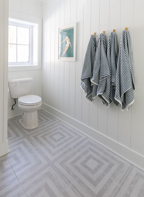 Coastal Pool House, Poolhouse Bathrooms, White Paneled Walls, Poolhouse Bathroom, Pool Bathroom Ideas, Cabana Bathroom, Coastal Pool, Grey Tile Pattern, Pool House Bathroom