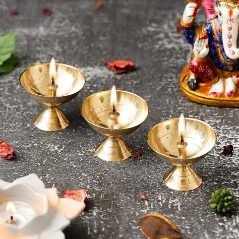 Webelkart Premium Small Brass Set of 3 Oil Lamp Diya for Diwali Decor |Aarti Diya|Deepak Oil Lamp for Home and Pooja Decoratoin ( Brass 2.16" Inhes ) Temple Articles About product : PERFECTLY SIZED: Measures 4" x 4" x 5.5" Cm Gold Brass Diya Set Of 3 TRADITIONAL DESIGN This type diya has been used for Diwali for centuries A beautiful decorative element for your home or altar Makes a wonderful gifting option, Great Gifts Ideas Care Instructions: Wet the Diya with water ,sour with pitambari po... Diwali Diya, Diwali Decor, Diwali Decorations, Oil Lamp, Gold Brass, Oil Lamps, Gifts Ideas, Traditional Design, Diwali