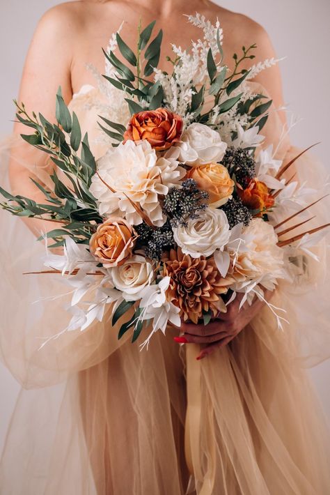 This cute burnt orange and ivory rose wedding bouquet is a stunning silk flower arrangement perfect for an autumn ceremony. This artificial boho bouquet captures the essence of fall with its warm hues and elegant design. Ideal for a fall wedding bouquet set, it offers a timeless and low-maintenance alternative to fresh flowers, ensuring lasting beauty throughout your special day. ○ Color: burnt orange, ivory, green, white ○ Personalization: I can make changes to your wishes. Colors can be change Bouquet Fall Wedding, Fall Wedding Bouquet, Silk Flower Bouquet, Fall Wedding Color Palette, Fall Bouquet, Burnt Orange Weddings, Enchanting Wedding, Rustic Bouquet, Silk Flower Bouquets