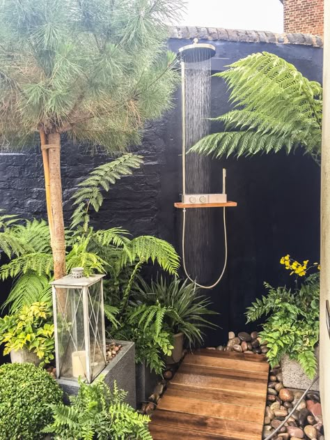 Outdoor shower with cedar wood boardwalk-on a deep blue wall. Finished with tree ferns. Outdoor Shower Terrace, Freestanding Outdoor Shower Ideas, Outdoor Shower Bali Style, Garden Shower Ideas, Outdoor Shower Tile, Garden Showers Outdoor, Outdoor Shower Ideas Private, Outside Shower Ideas, Outdoor Shower Diy